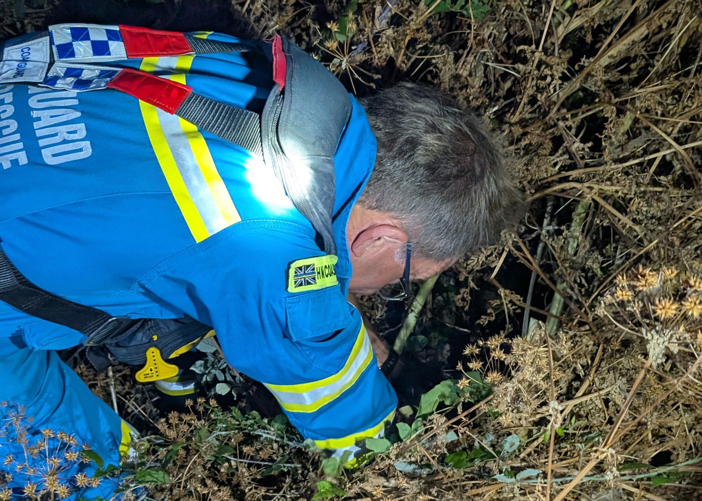 HM Coastguard rescuing the owl from the ditch